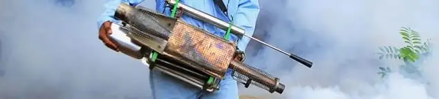 Fumigation technician using a fogger for deep pest treatment in Arlington, TX